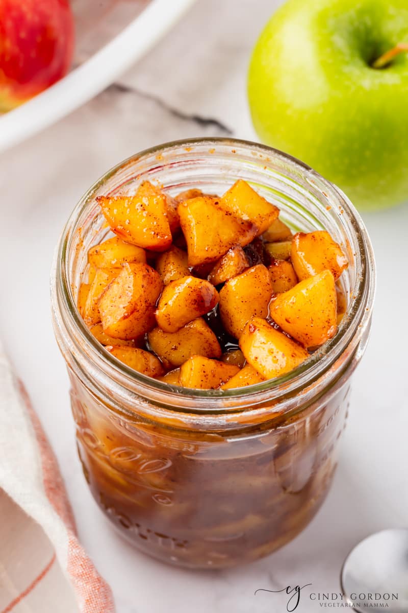 a small mason jar filled with chopped apple compote