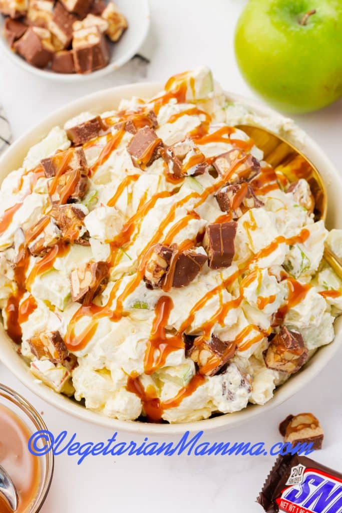 drizzle caramel sauce over the top of the mix of pudding, apples, snickers, and marshmallows.