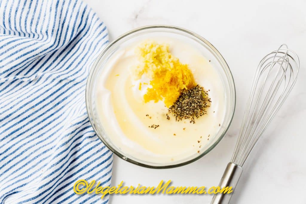 Add the garlic to a bowl with the mayonnaise, lemon juice, lemon zest, salt and ground black pepper.