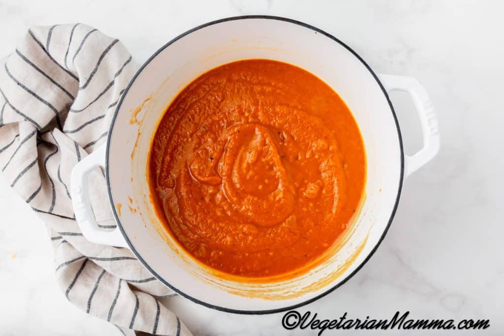 Then, pour in the vegetable broth, and stir until smooth.