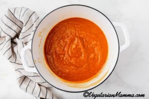 Then, pour in the vegetable broth, and stir until smooth.