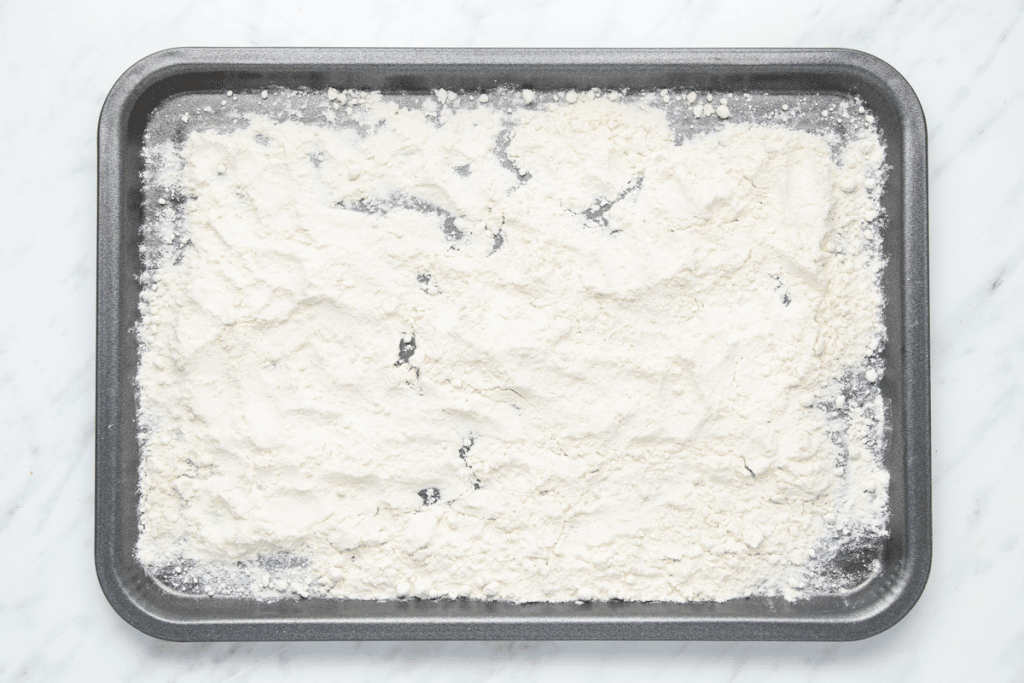 flour spread onto a baking sheet