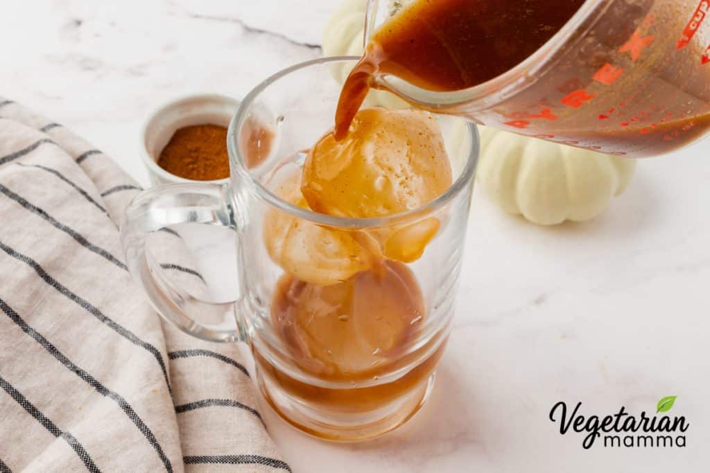 Add ice cubes to a large glass, then pour the espresso mixture over the ice.