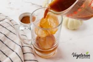 Add ice cubes to a large glass, then pour the espresso mixture over the ice.