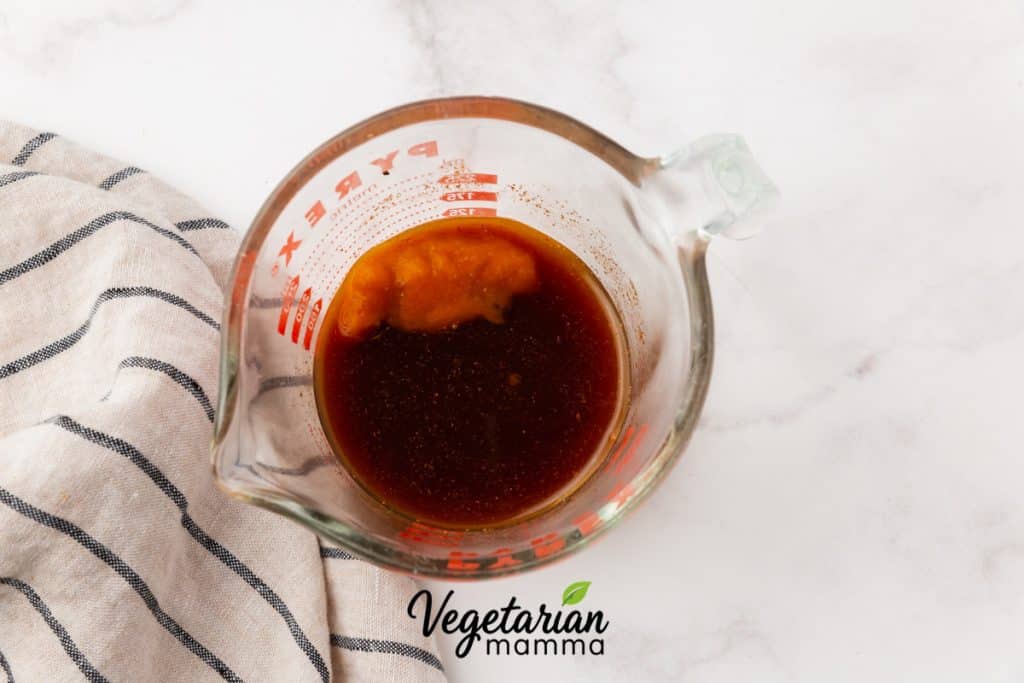 Add the espresso, pumpkin puree, maple syrup, vanilla extract, pumpkin pie spice, and salt to a mug or jar.