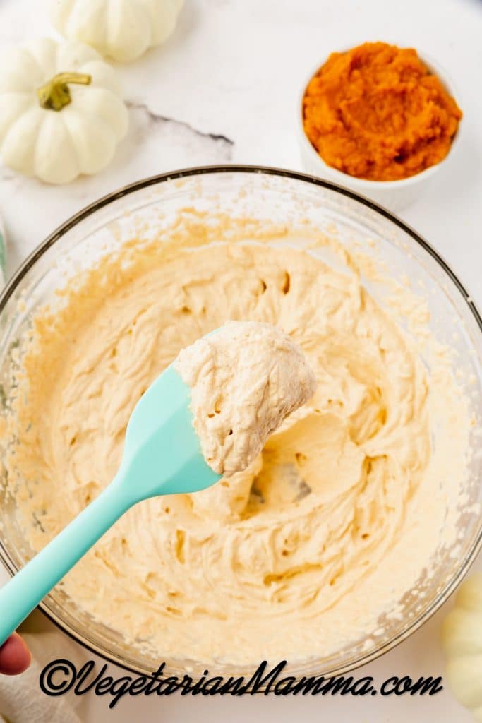 pumpkin whipped cream with a spatula.