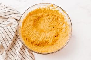 Pumpkin cream cheese dip after mixing with a hand mixer.