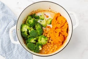 Pumpkin, broccoli, chickpeas in a pot for curry