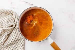 Milk, pumpkin, spices in a saucepan