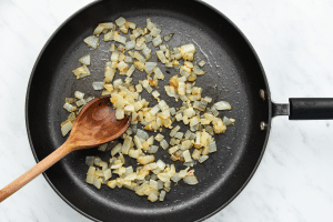 diced onions sauteed in a pan