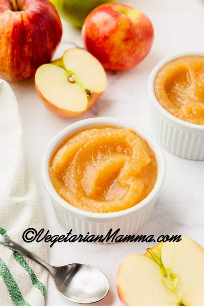 Place in white cup for serving. Pictured with apples and a spoon.