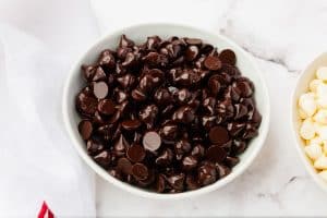 a bowl of chocolate chips mixed with vegetable oil