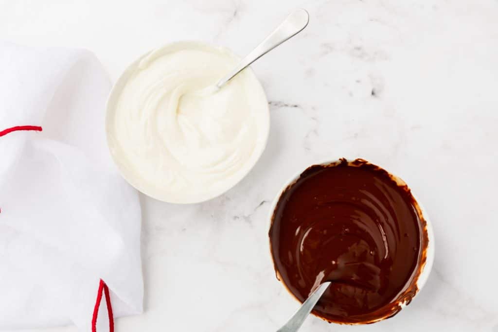 two bowls. One filled with melted white chocolate, one filled with melted semisweet chocolate
