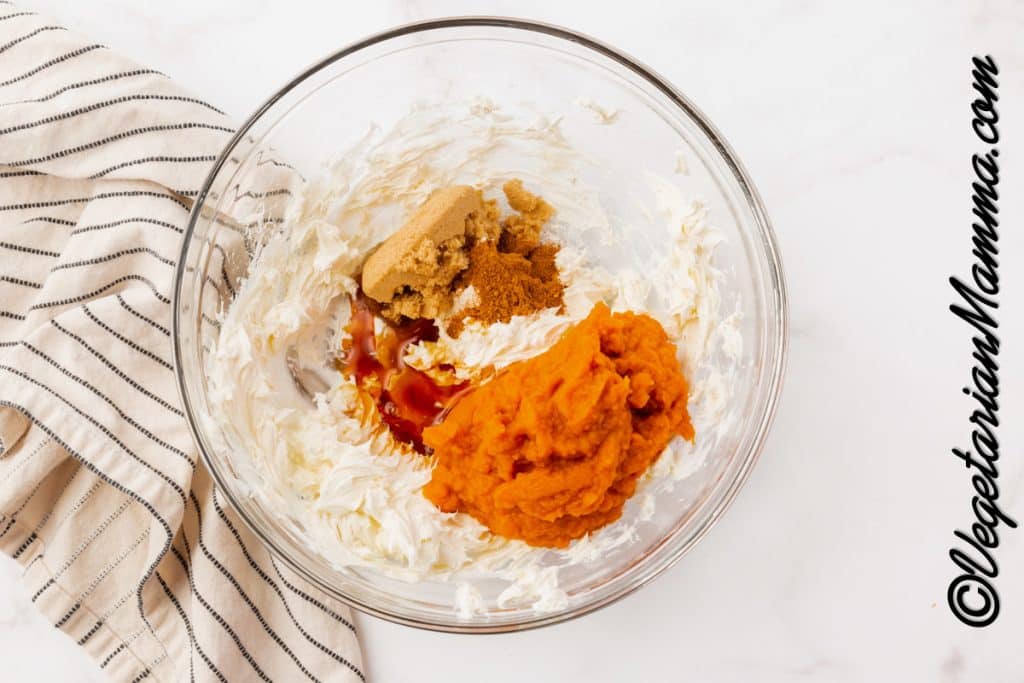 Add pumpkin puree, pumpkin spice, vanilla to the cream cheese.