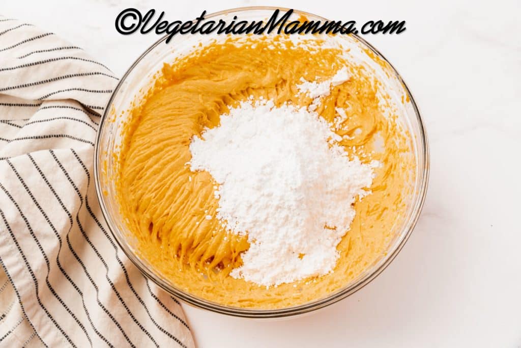 Gradually add in the powdered sugar and mix until incorporated.