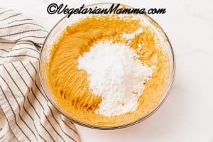 Gradually add in the powdered sugar and mix until incorporated.