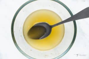 Fruit salad dressing in a small glass bowl