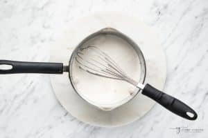 coconut milk added to a small saucepan.