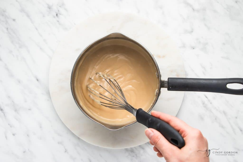coconut cream pie filling in a saucepan, thickened.