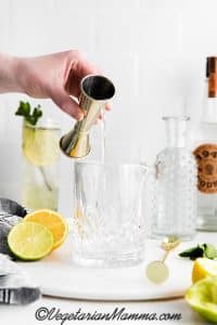 pour vodka into highball glass or shaker.