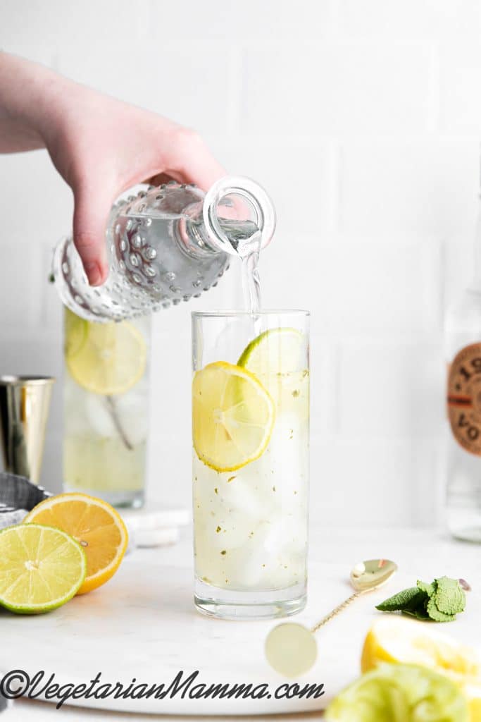 Add soda water and ice