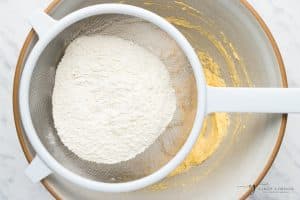flour sifted through a sieve.