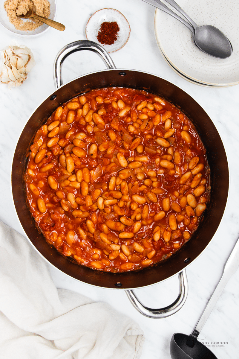 a stockpot filled with baked beans.