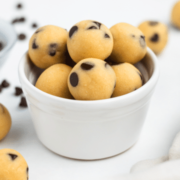 a ramekin filled with edible chocolate chip cookie dough bites.