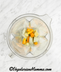 First peel the green apple, turmeric and the ginger. Then place the peeled turmeric, peeled ginger, lemon juice, green apple, and water in a blender.