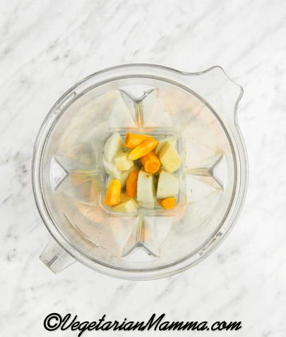 First peel the green apple, turmeric and the ginger. Then place the peeled turmeric, peeled ginger, lemon juice, green apple, and water in a blender.