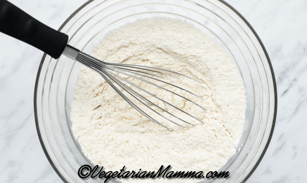 In a large mixing bowl, whisk together the flour, baking powder, salt and xanthan gum until well combined.
