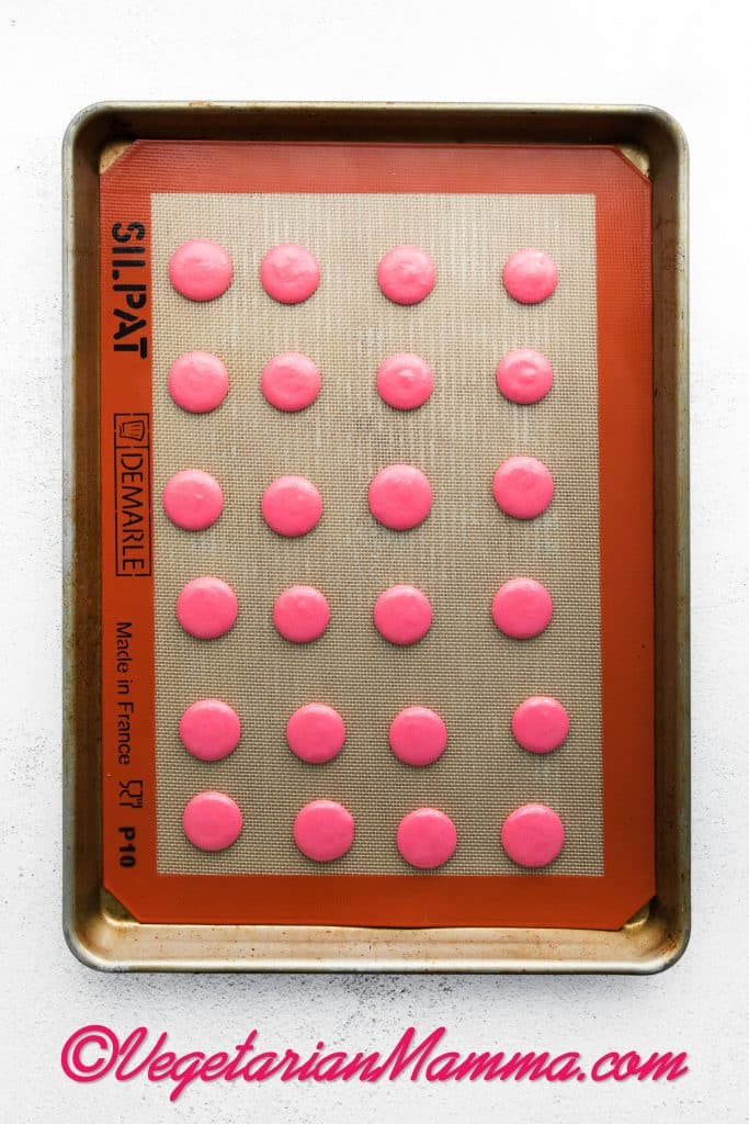 Pipe 1.5” circles about 2” apart onto the baking sheets.