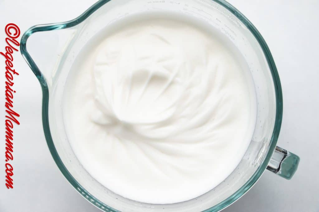 Whisk for 6-8 minutes, starting slowly and gradually increasing the speed to high, until white and fluffy with stiff peaks formed.