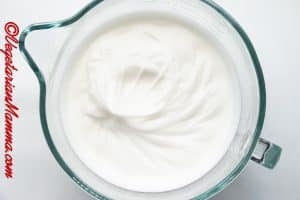 Whisk for 6-8 minutes, starting slowly and gradually increasing the speed to high, until white and fluffy with stiff peaks formed.