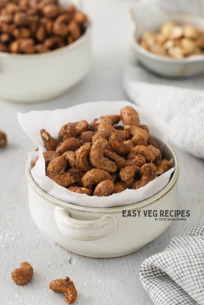a white crock filled with candied cashews.