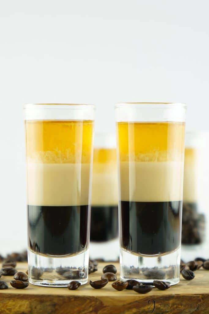 a row of tall layered duck fart shots.