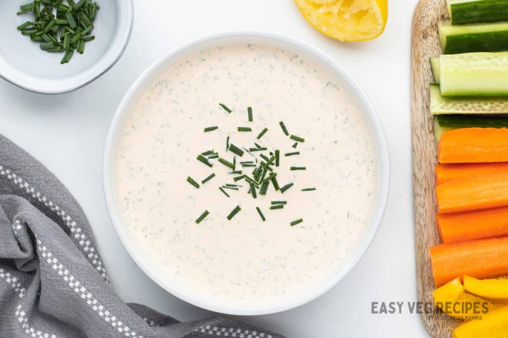 A bowl of seasoned sour cream topped with chives