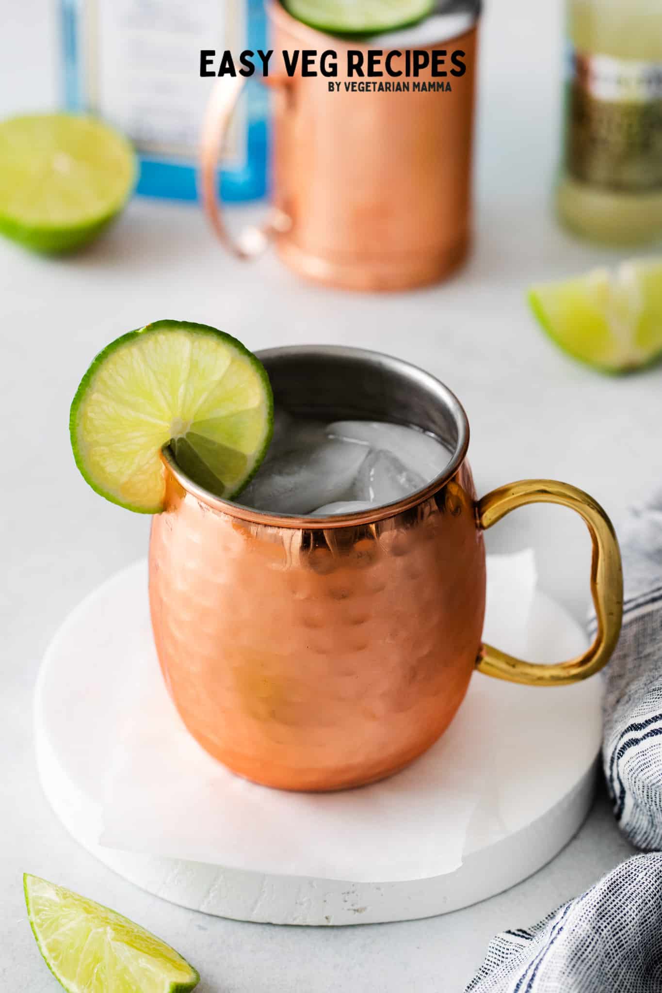 a london mule in a chilled copper mug with ice and a lime wheel garnish