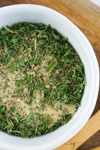 a small bowl of homemade spaghetti seasoning with dried parsley