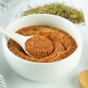 a white bowl of homemade cajun seasoning