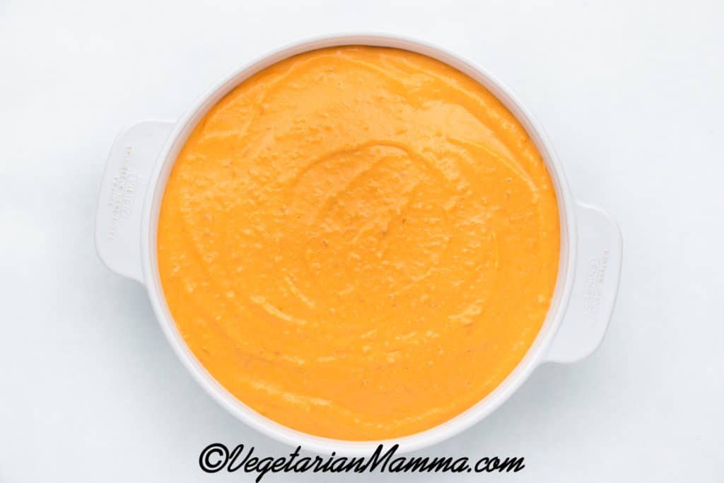 Vegan buffalo chicken dip placed in casserole dish after blended.