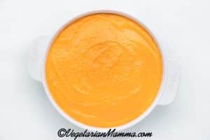 Vegan buffalo chicken dip placed in casserole dish after blended.