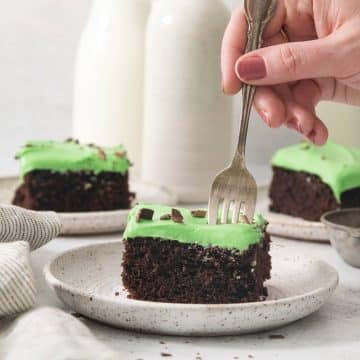 Piece of mint chocolate cake that is ready to eat.