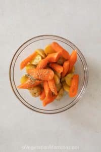 Carrots and spices in a bowl.