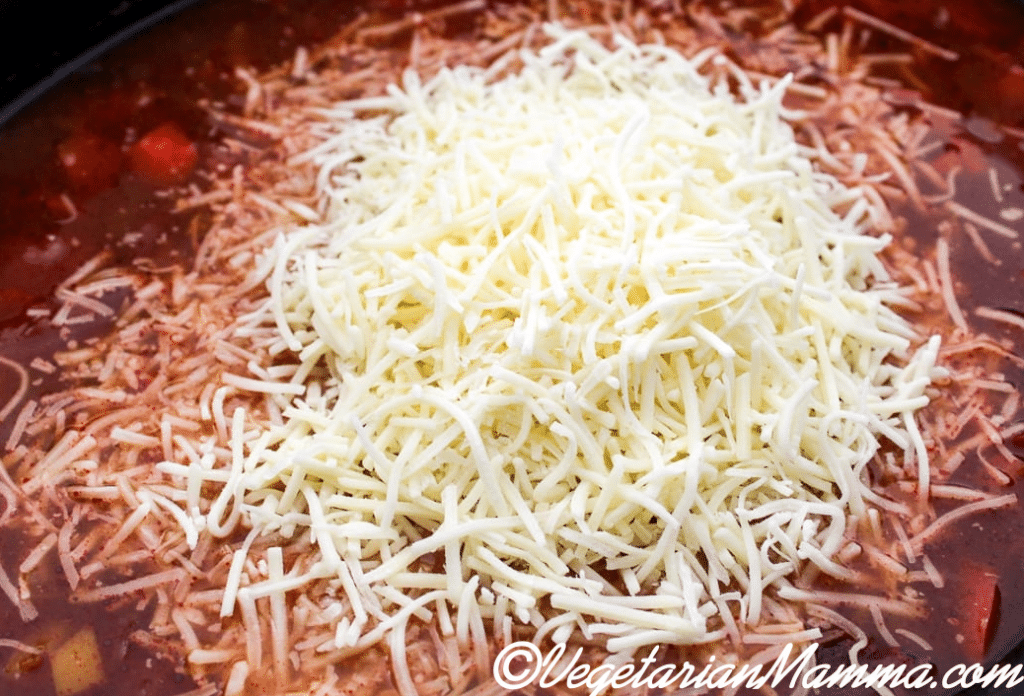 Shredded cheese in soup.