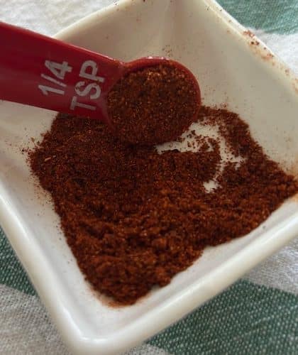 chili powder in a dish with a 1/4 teaspoon scooping it out, but you only need a pinch