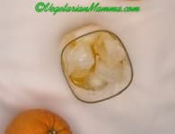 Squeezed oj into a glass with ice.