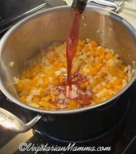 Add your red wine and stir thoroughly until it begins to bubble.