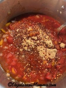 Add your dry ingredients – sugar, red pepper flakes, garlic and salt.