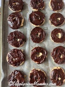 Bottom of cookie dipped in chocolate.